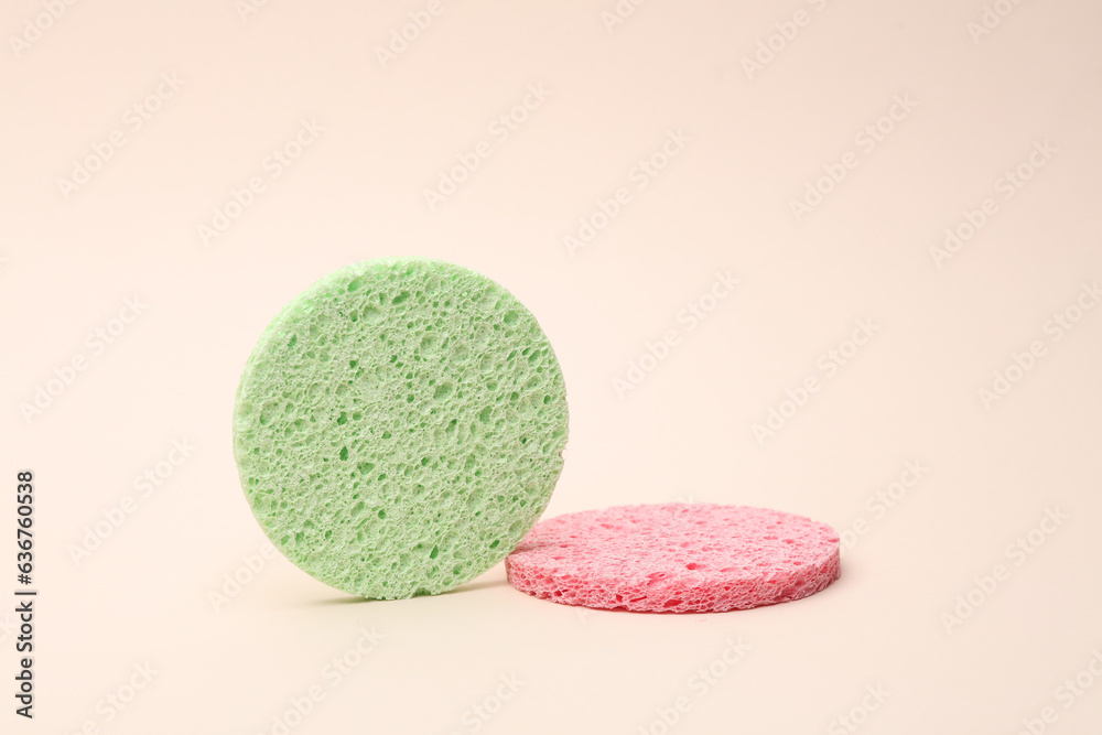 Make-up remover sponges on beige background Make-up remover sponges on beige background