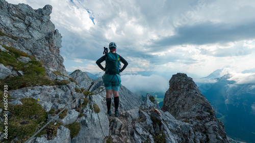 Female hiker climbing via ferrata "mittenwalder Höhenweg" between Mittenwald and Scharnitz. © Salvati Photography