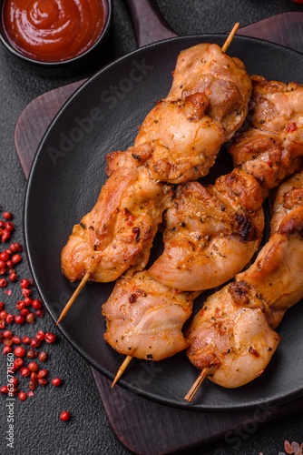 Delicious fresh, juicy chicken or pork kebab on skewers with salt and spices