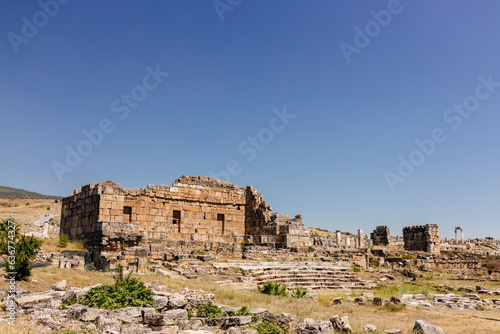 Old dilapidated architecture of Turkey. Ruins of an ancient city. Journey to the old city. Mountain landscape. Ancient city of Hierapolis, Pamukkale, Türkiye - July 29, 2023