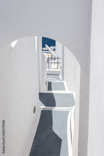 Canvas Print Traditional Greek architecture, white washed walls; stairways leading down to the sea