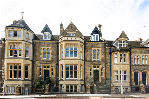 A row of traditional four storey Victorian townhouses