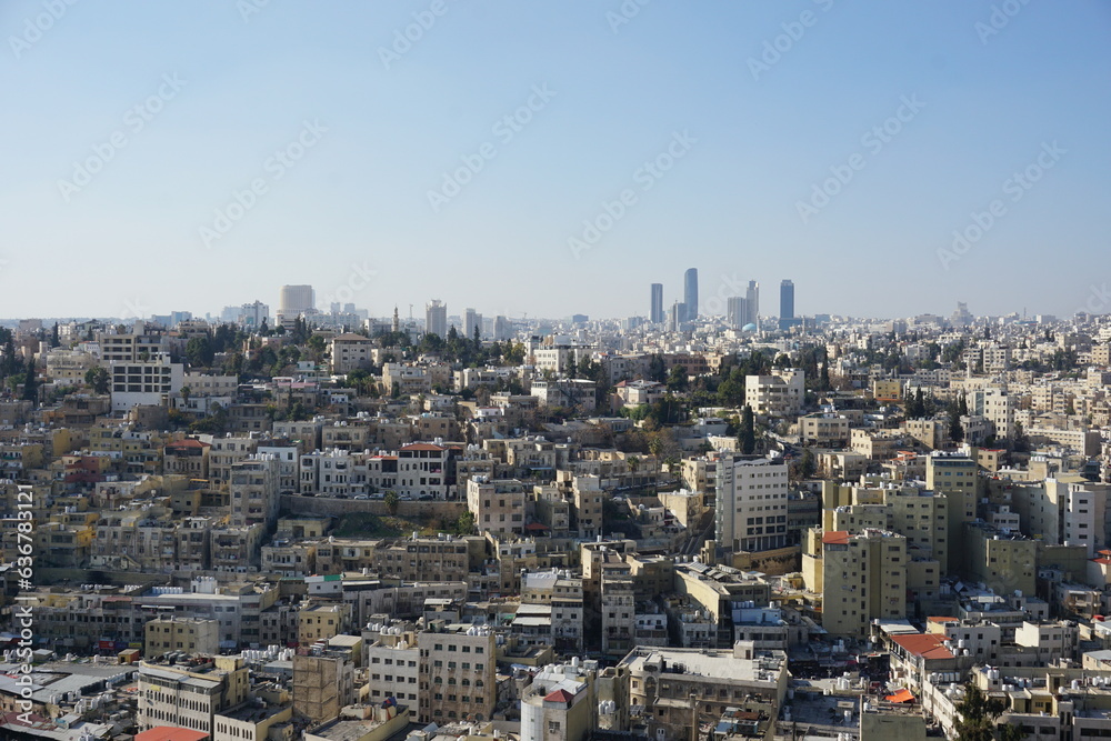 Fototapeta premium Panorama of Amman city in Jordan - the contrast of public housing and modern skyscrapers.