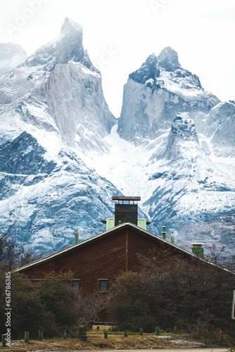 House and snowy mountains in Torres del Paine National Park