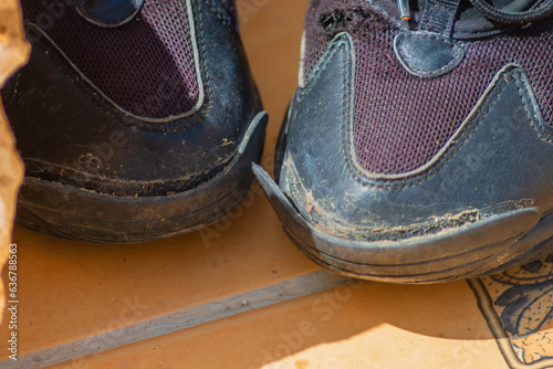 Photography Worn-out shoe showing the growth of inflation and the aggravation of the economi