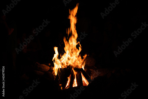 bright orange fire flames on a black background. High quality photo