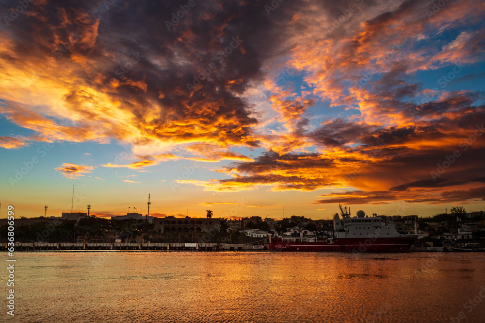 Naklejka premium sunset over the river