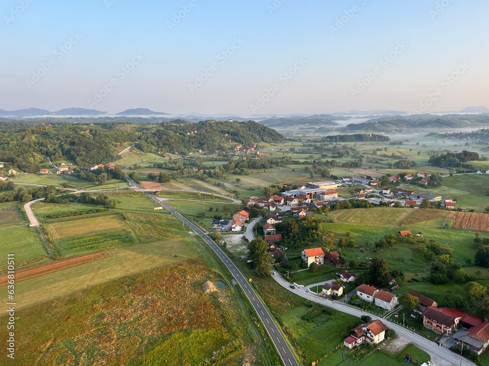 View of forests, fields, villages and Zagorje hills, during a panoramic balloon flight over Croatian Zagorje - Croatia (Panoramski let balonom iznad Hrvatskog zagorja - Hrvatska) View of forests, fields, villages and Zagorje hills, during a panoramic balloon flight over Croatian Zagorje - Croatia (Panoramski let balonom iznad Hrvatskog zagorja - Hrvatska)