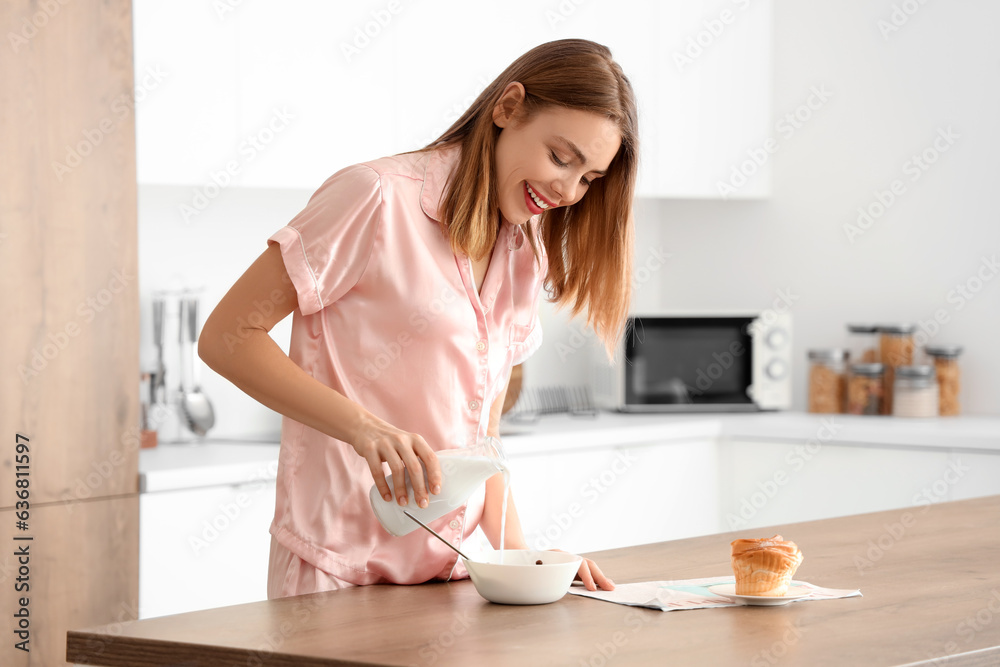 Young pregnant woman preparing breakfast in kitchen Young pregnant woman preparing breakfast in kitchen