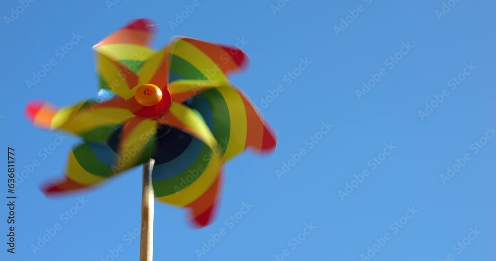 Pinwheel colors of the rainbow on the background of the sky. LGBT colors concept.