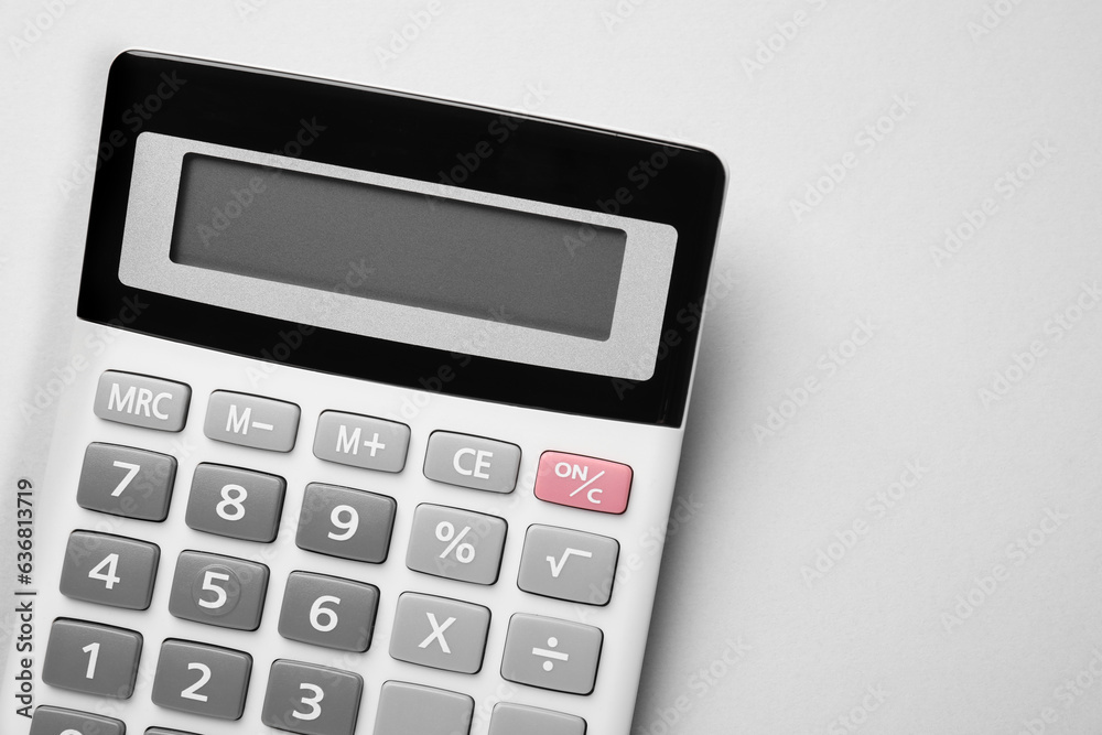 Calculator on light gray background, top view. Space for text Calculator on light gray background, top view. Space for text