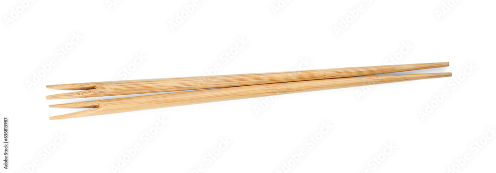 Pair of wooden chopsticks isolated on white, top view