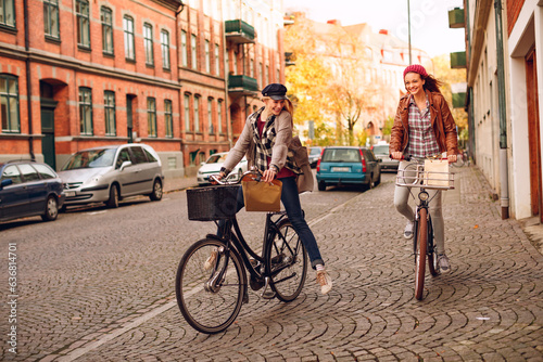 Young lesbian couple shopping and riding their bicycles in the city
