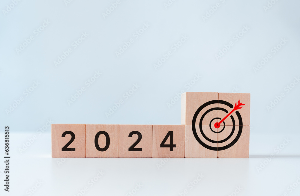 2024 goals of business target achievement or life. Wooden cubes block with 2024 and goal icon on white background. Starting to new year. Business common goals for planning new project, annual plan.
