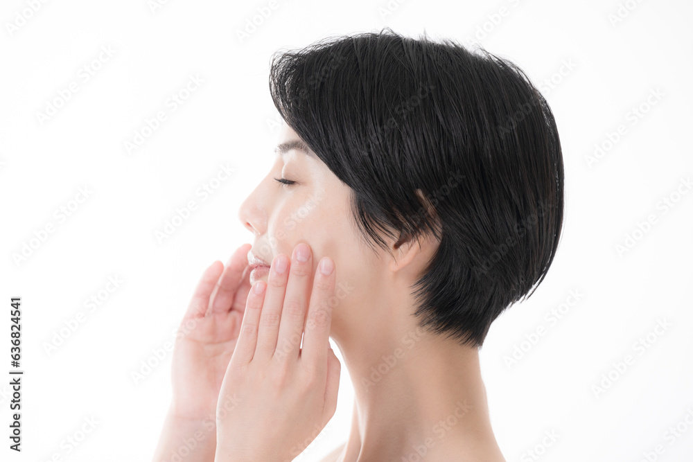 Woman doing small face massage and skin care, glowing skin profile Woman doing small face massage and skin care, glowing skin profile