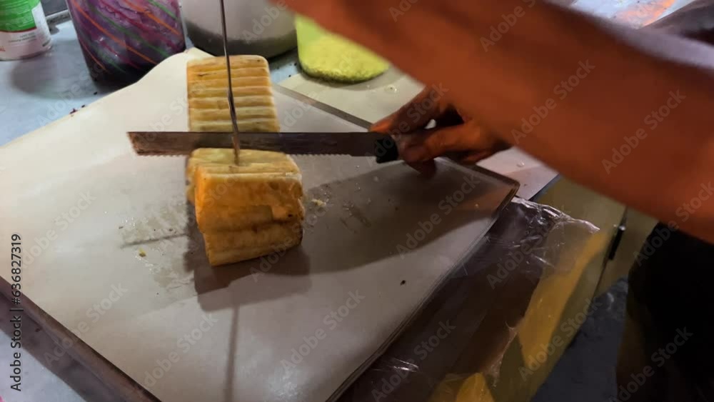 Street food booth selling Roti Bakar Bandung which is Indonesian toast bread with variety of flavor and topping