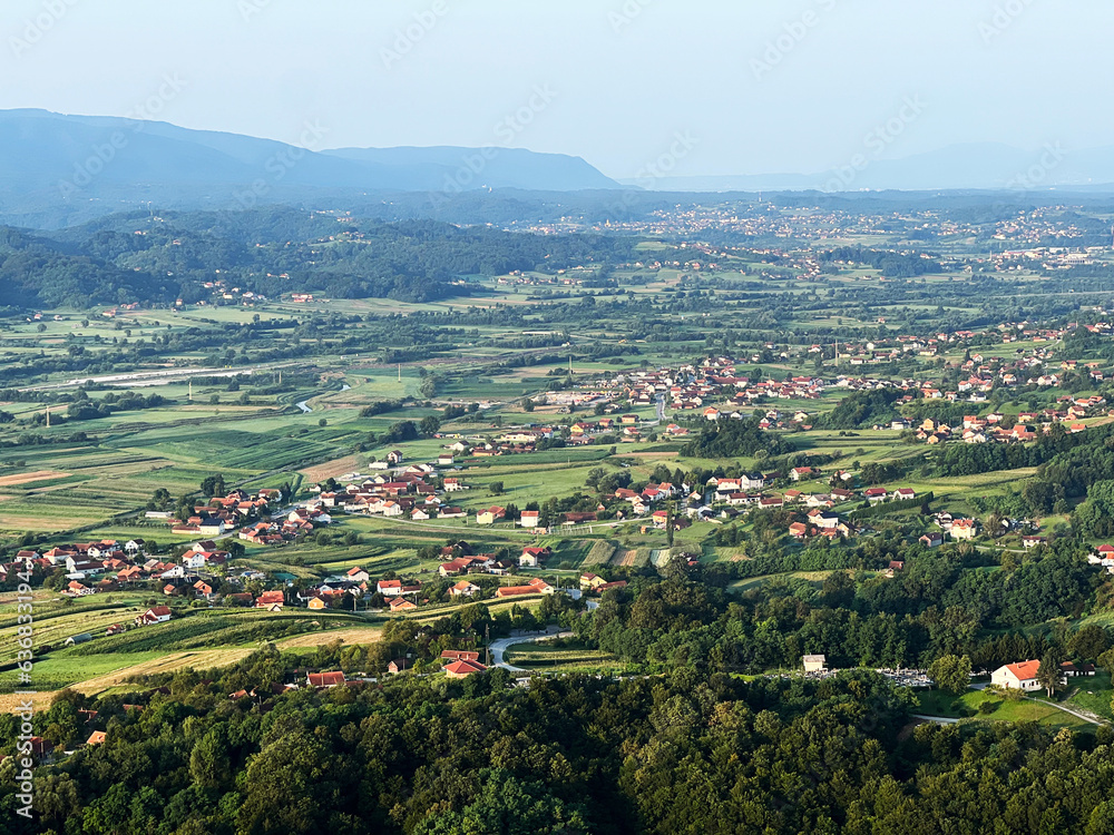 Obraz premium View of forests, fields, villages and Zagorje hills, during a panoramic balloon flight over Croatian Zagorje - Croatia (Panoramski let balonom iznad Hrvatskog zagorja - Hrvatska)