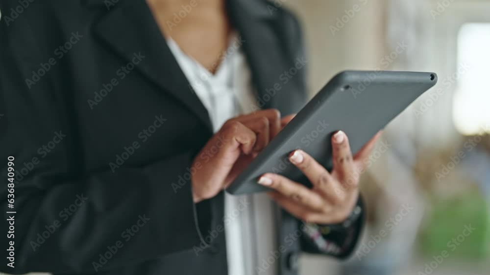 African american woman architect using touchpad at construction site African american woman architect using touchpad at construction site