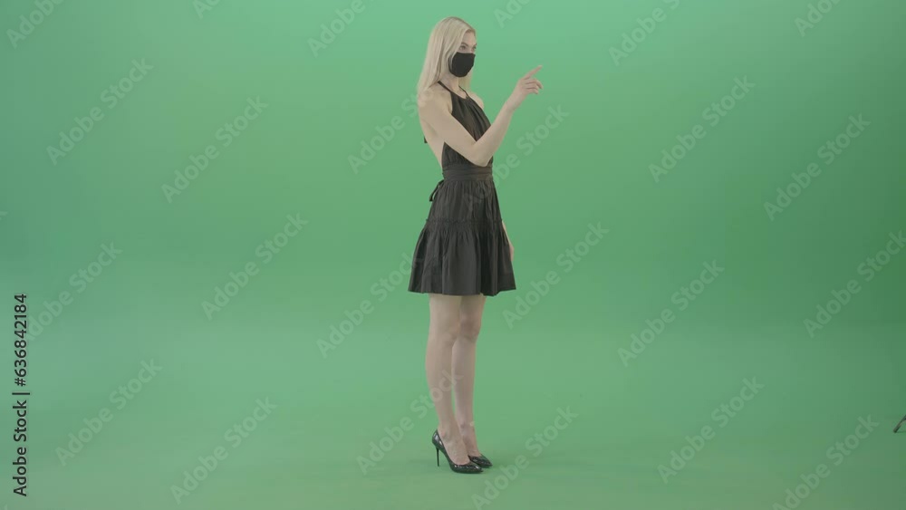 Covid 19 Girl in Mask looking a virtual products on touch screen shop Covid 19 Girl in Mask looking a virtual products on touch screen shop