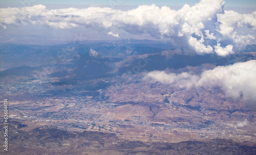mountains and valley at san gorgonio pass riverside county, with clouds over the san jacinto area, san bernardino mountains, highland springs, cherry valley, banning, beaumont, interstate 10