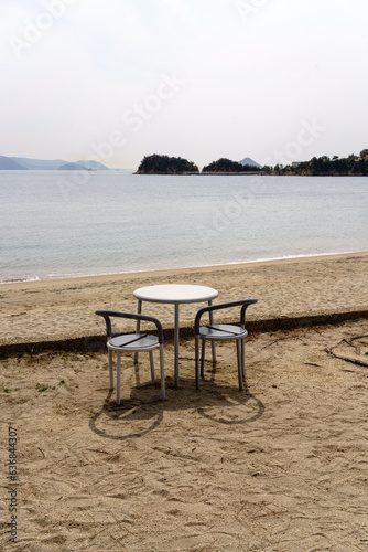 table and chairs on the beach