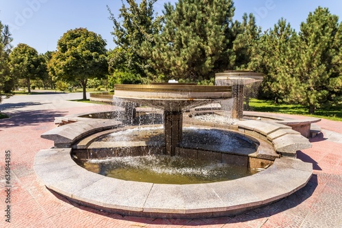 Water fountain with splashes of water for relaxation and coolness of the city and parks