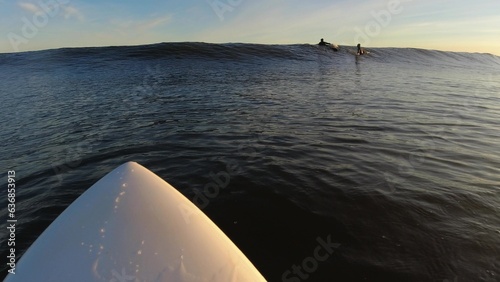 Surfer Paddling on Baltic Sea Waves at Sunrise POV Slow Motion