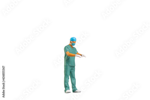Miniature people young doctor in scrubs Isolated on white background with clipping path