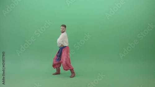 Slavic dancing man dance hopak in national ukraine costume isolated on green screen (ID: 636857960)
