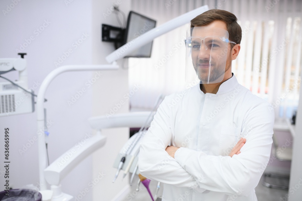 Young male dentist in clinic
