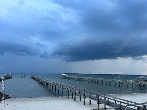 Storm clouds over ocean pier  © Elizabeth