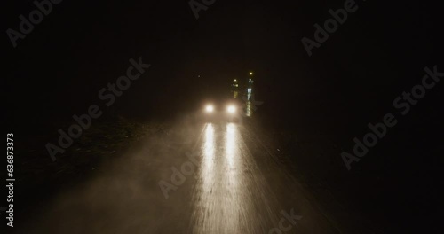 Cars driving in the rain at night 16