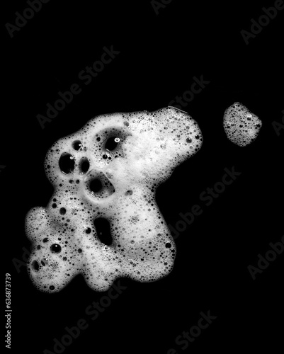 liquid white foam from soap or shampoo or shower gel Abstract soap bubbles. Set foam, soap bubble isolated on black, with clipping path texture and background.
