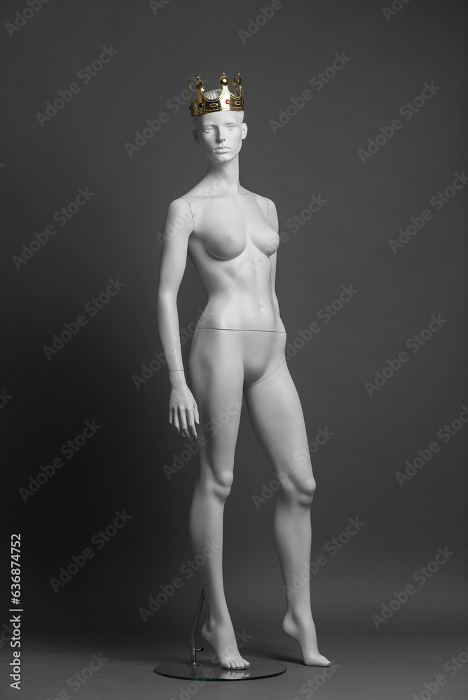 Fototapeta premium White female mannequin with golden crown on her head. Vip boutique concept. Shop queen.