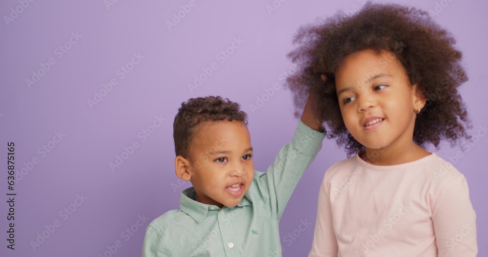 two adorable cute children touching each other hair, have fun slow motion. relationship two adorable cute children touching each other hair, have fun slow motion. relationship