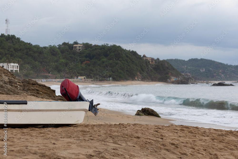 Tourist transport boat on the sand on the beach of Mazunte, Oaxaca Tourist transport boat on the sand on the beach of Mazunte, Oaxaca