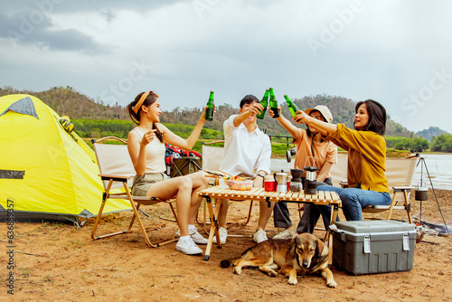 Vacation trips camping trips natural places : Happy group male and female friends singing songs and drinking beer having fun on vacation travel camping holiday trips natural fields.