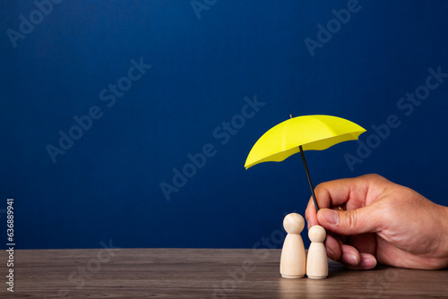 Hand holding umbrella and cover family.