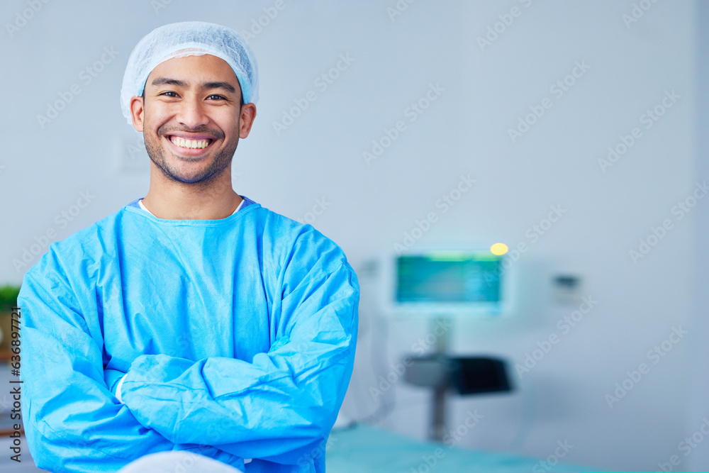 Portrait, surgeon and Asian man with arms crossed in hospital, healthcare and wellness. Face, happy doctor and medical professional, expert nurse and confident surgery employee in scrubs in Cambodia