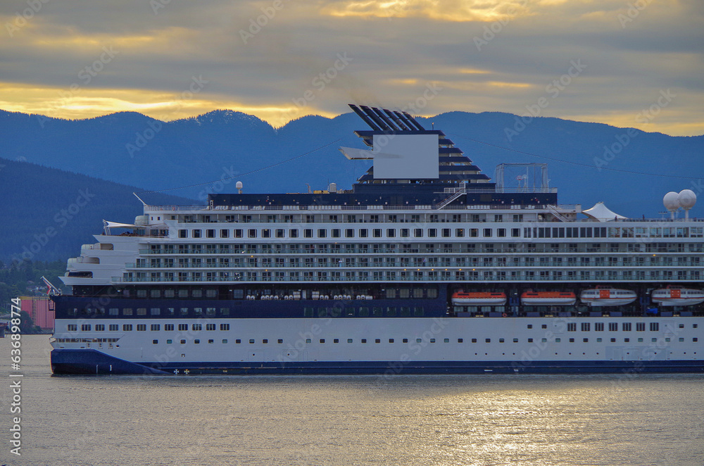 Luxury cruiseship cruise ship liner Century arrival sail into port of Vancouver, BC Canada from Alaska Last Frontier adventure cruising during sunrise with beautiful scenic view	