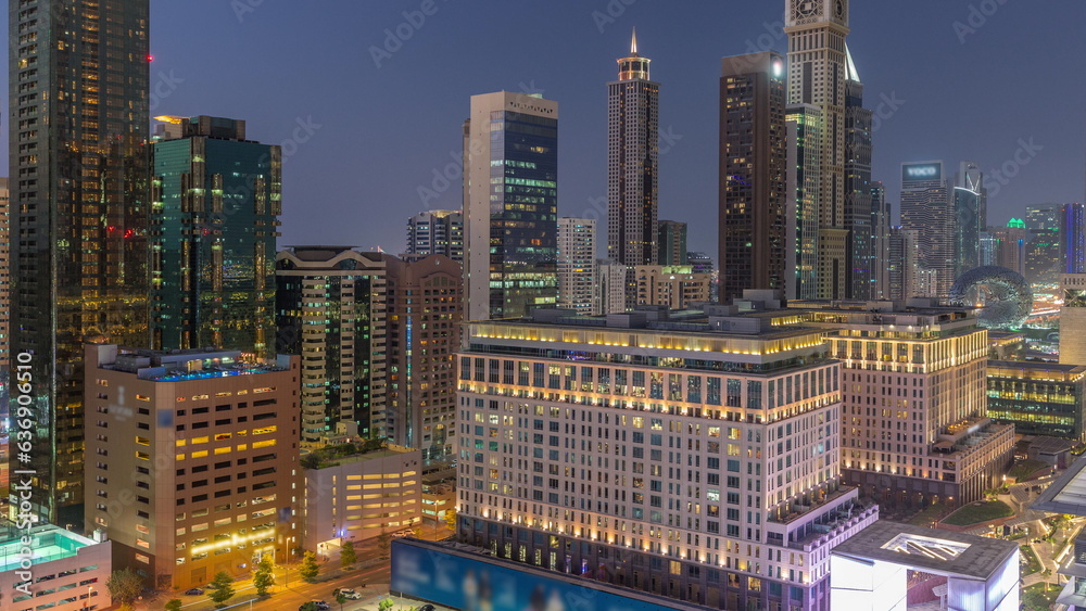 Naklejka premium Dubai International Financial district aerial day to night timelapse. Panoramic view of business and financial office towers.