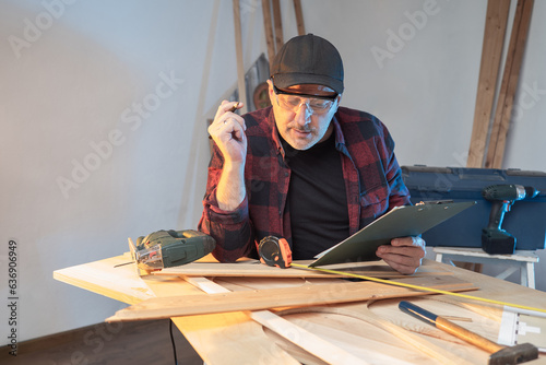 Man is carpenter. Furniture...