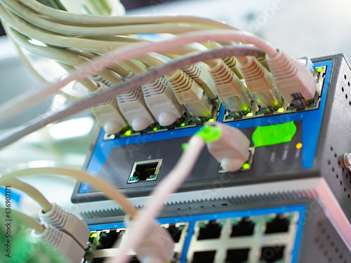 Network equipment and wires. Internet technologies. Equipment with network cable connection points. Providing internet connection at enterprise. Network switches. Wires for high-speed internet supply