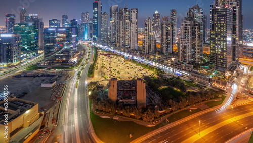 Bay Avenue with modern towers residential development in Business Bay aerial panoramic day to night timelapse  Dubai