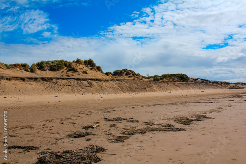 The view of the Formby Beach (Victoria Road Beach) or Formby Dunes in Liverpool, UK at sunny day. City in Merseyside county of North West England. Including the famous sand dunes. Nature, travel scene