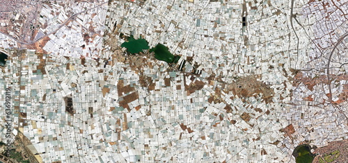 Wallpaper Mural Sea of plastic, photograph that shows the environmental impact on the landscape caused by thousands of greenhouses covered by plastics on the coast of Almería, Spain, Torontodigital.ca