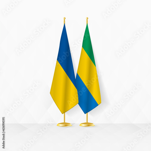 Ukraine and Gabon flags on flag stand, illustration for diplomacy and other meeting between Ukraine and Gabon.