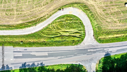 Vertical aerial view of an arched turnoff on a paved bike path photo