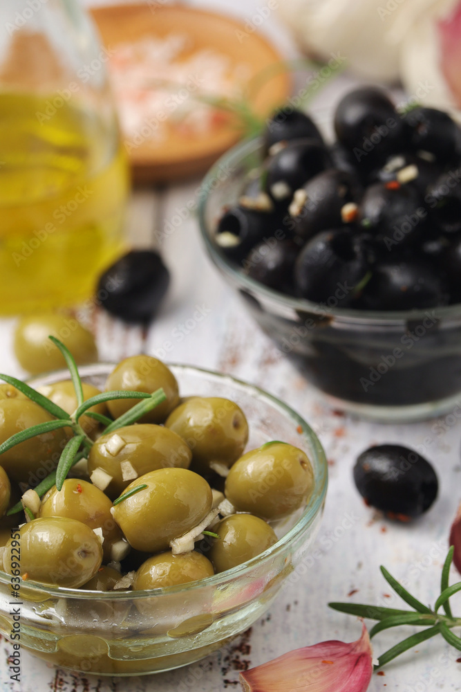 Black and green olives in glass bowls Black and green olives in glass bowls