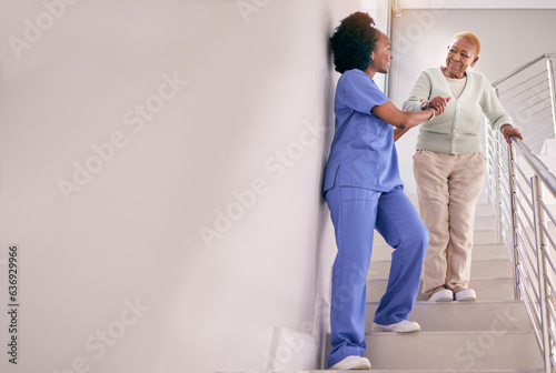 Nurse, stairs and help senior woman, holding hands and assistance in home. Caregiver, steps and elderly African patient walking down, support of person with a disability and happiness in healthcare